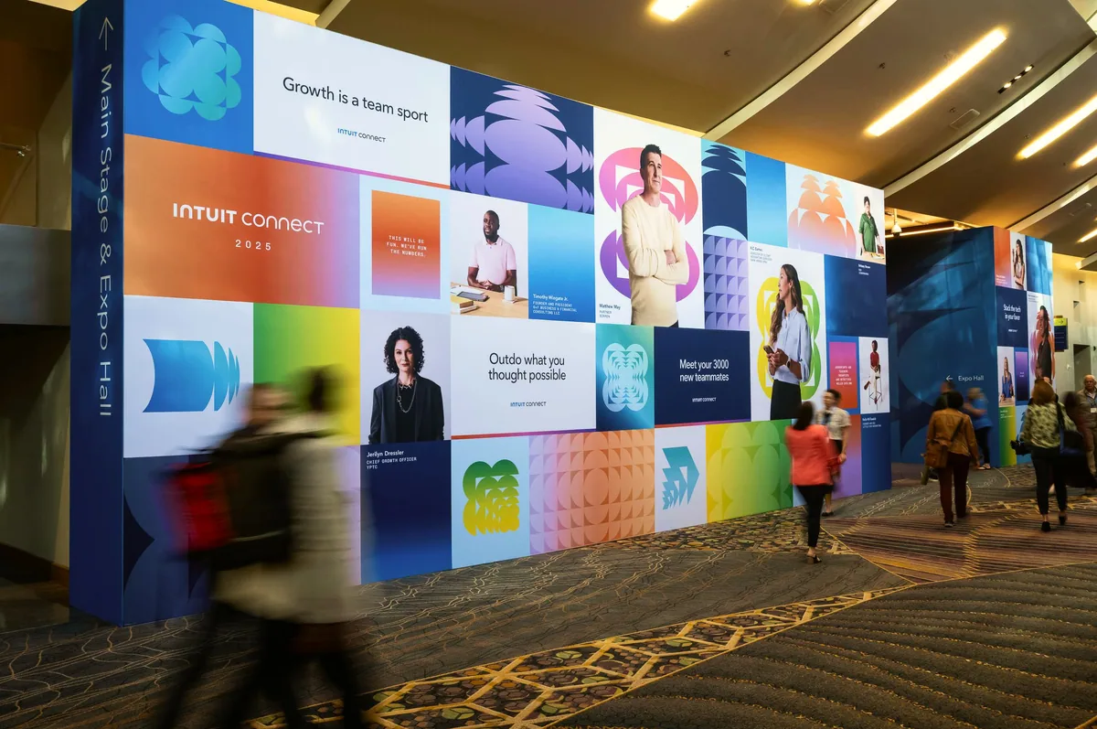 Graphic portrait wall lining the expo corridor