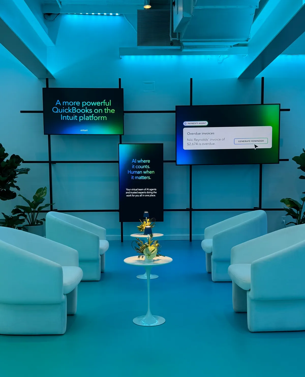 Lounge seating in front of a product video wall