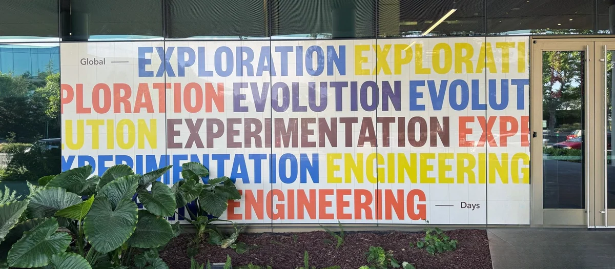 Exploration, Evolution, Experimentation, Engineering supergraphic wall