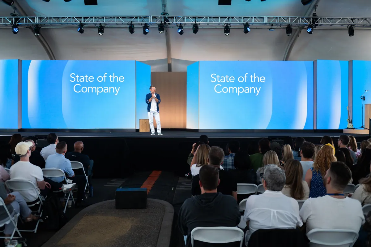 State of the Company stage under a tent