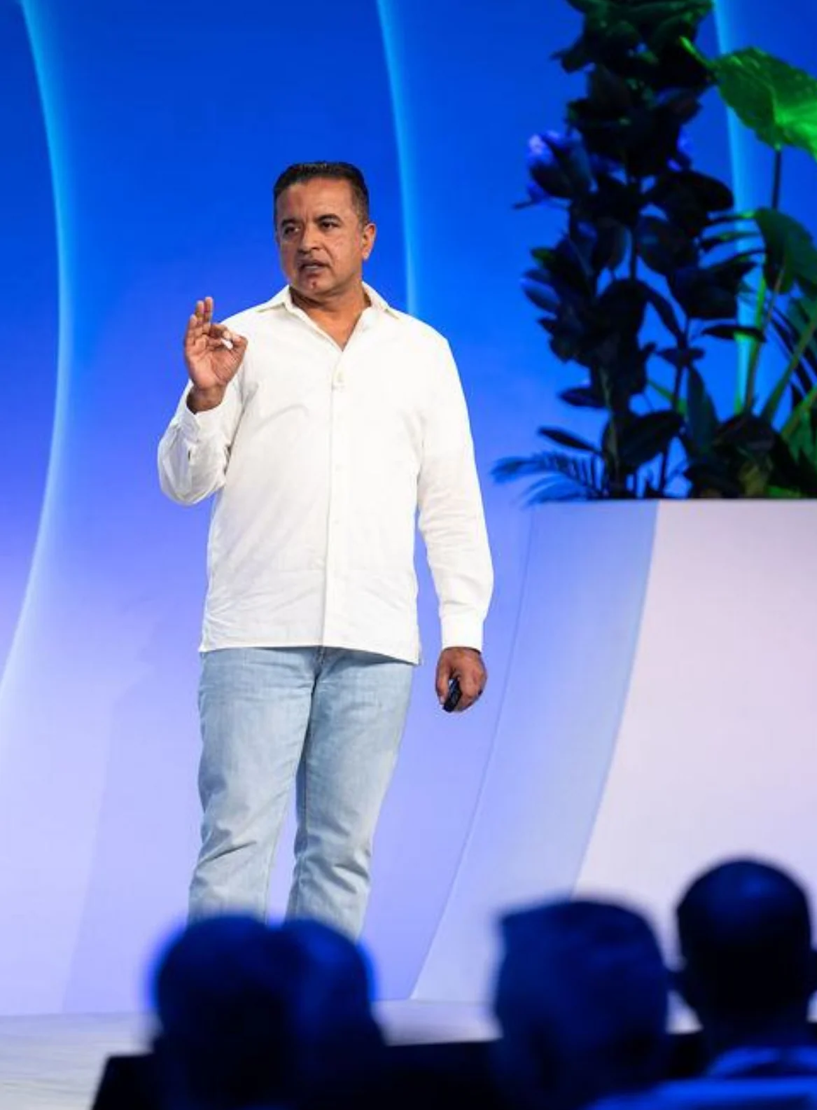 A speaker and a panel on the white stage