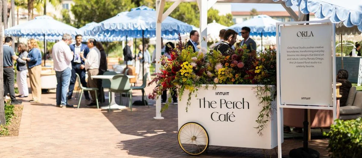 The Perch Café flower cart under blue scalloped umbrellas
