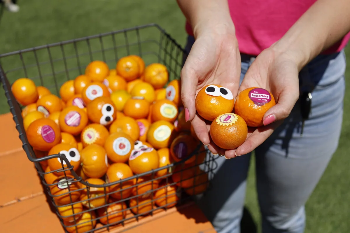 A basket of oranges with googly eyes