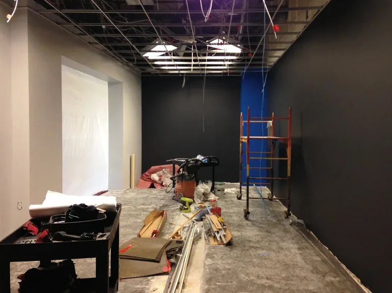 Construction underway with the black walls painted