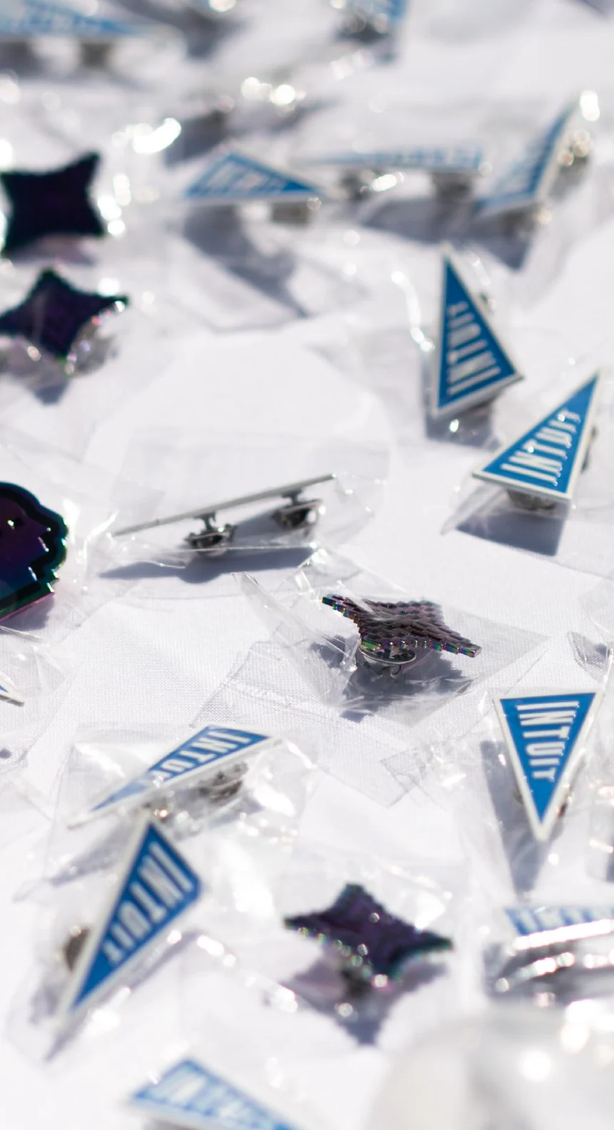 Pins, embroidery and tote bags from the event